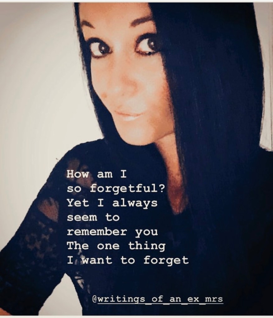 How am I so forgetful? Yet I always seen to remember you.  The one thing I want to forget.  Woman with dark hair wearing a black lace shirt with a smirk on her face